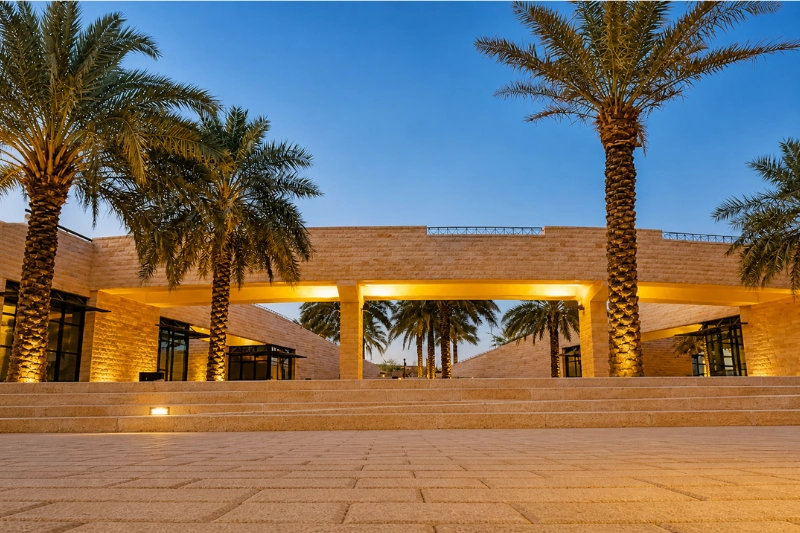 Entrance area of Lake Park Riyadh with palm trees and modern architecture