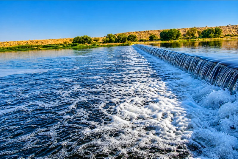 Waterfall at Lake Park Riyadh with flowing water and clear blue sky