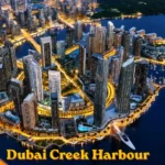 Aerial view of Dubai Creek Harbour waterfront skyline at night
