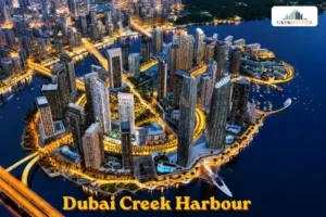 Aerial view of Dubai Creek Harbour waterfront skyline at night