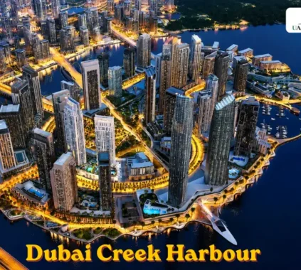 Aerial view of Dubai Creek Harbour waterfront skyline at night
