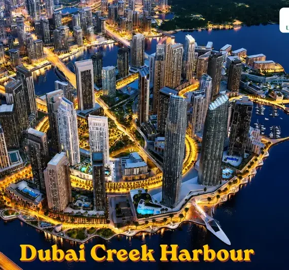 Aerial view of Dubai Creek Harbour waterfront skyline at night