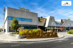 Galleria Mall Al Barsha exterior view in Dubai with entrance and retail stores visible.