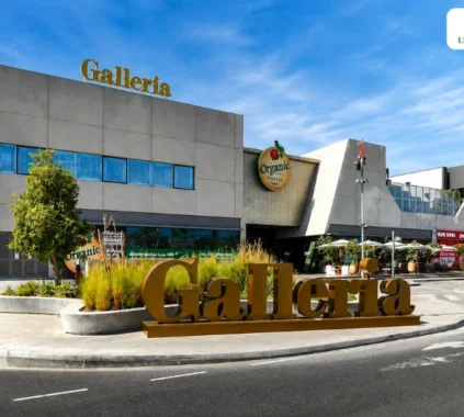Galleria Mall Al Barsha exterior view in Dubai with entrance and retail stores visible.