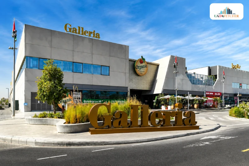 Galleria Mall Al Barsha exterior view in Dubai with entrance and retail stores visible.